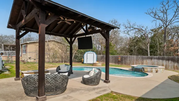 a view of a house with swimming pool