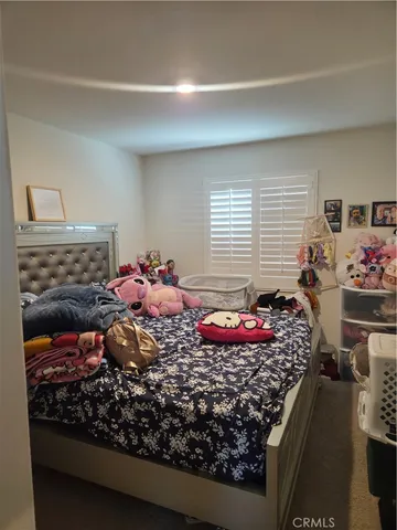 a bedroom with a bed and a table