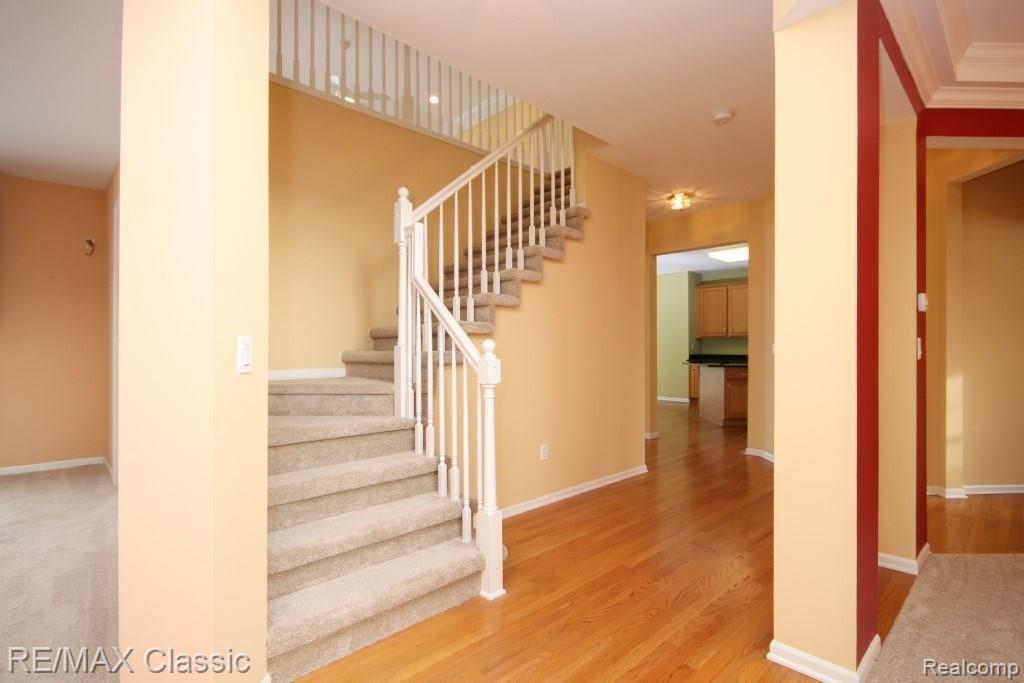 47790 Pavillon Road Canton, MI 48188 - Photo 12 of 45 Hardwood flooring in the foyer extends into the kitchen.