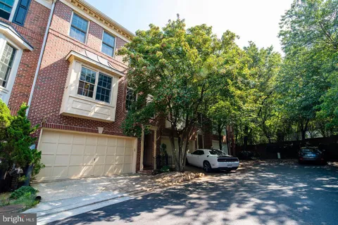 a view of a patio with table and chairs and potted plants