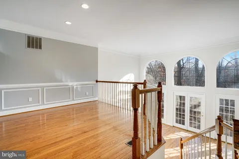 a view of an entryway with wooden floor