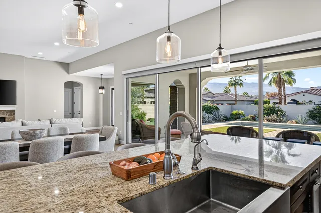 a view of a dining room and hall with furniture