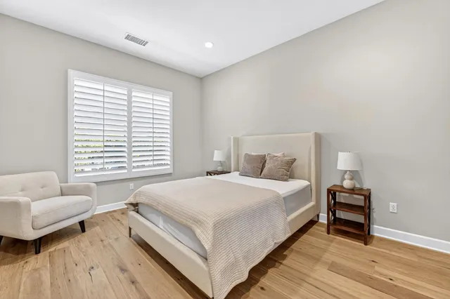 a bedroom with a bed and a couch