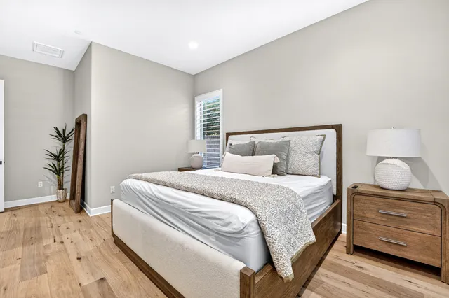 a bedroom with a bed and a dresser