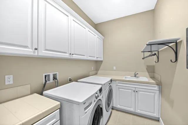 a utility room with dryer and washer
