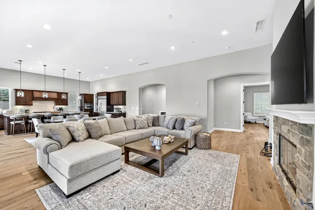 a living room with furniture and a fireplace