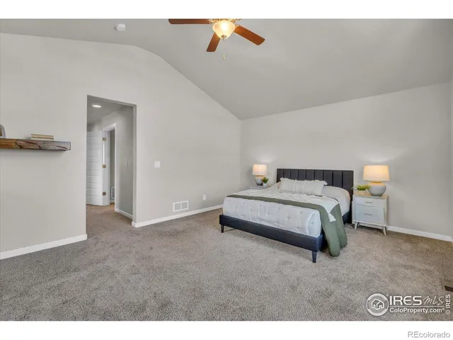 a bedroom with a bed and a cabinets