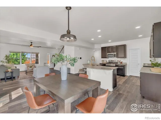 a kitchen with a table and chairs