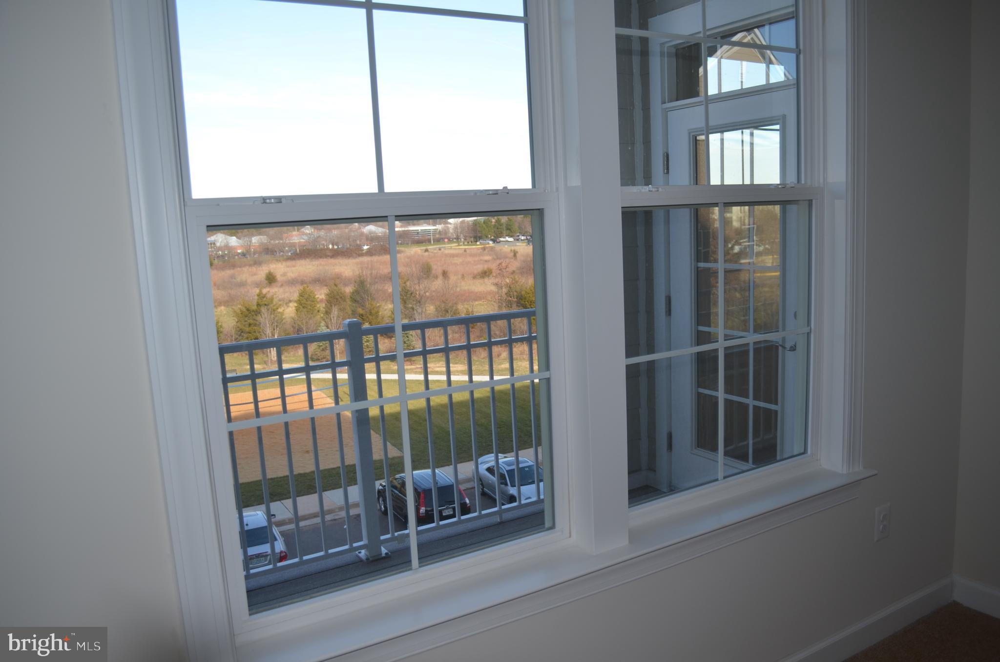 13724 Neil Armstrong Avenue, Unit 307 Herndon, VA 20171 - Photo 11 of 20 View from Primary Bedroom and Deck