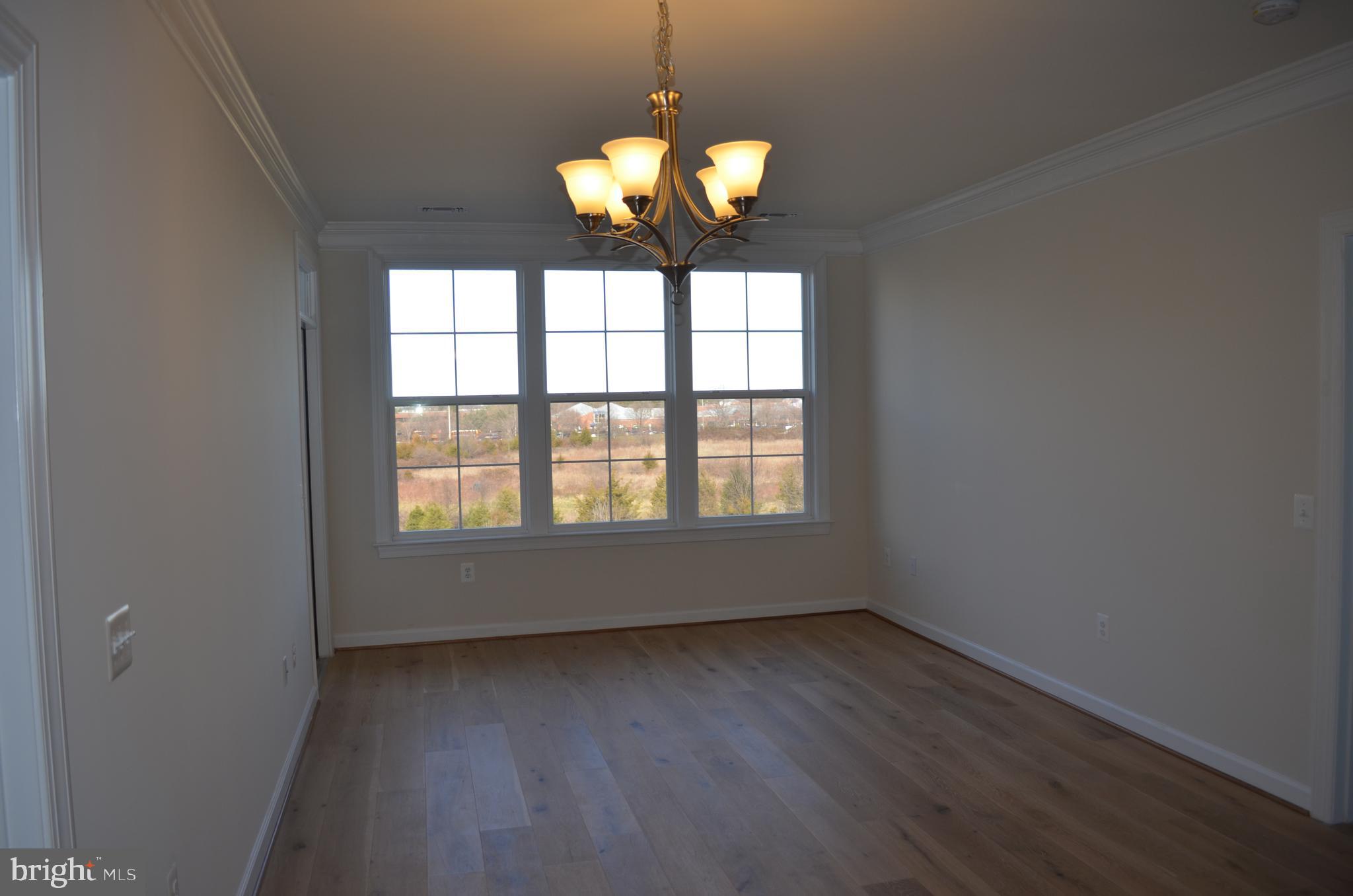 13724 Neil Armstrong Avenue, Unit 307 Herndon, VA 20171 - Photo 3 of 20 Living and Dining Rooms