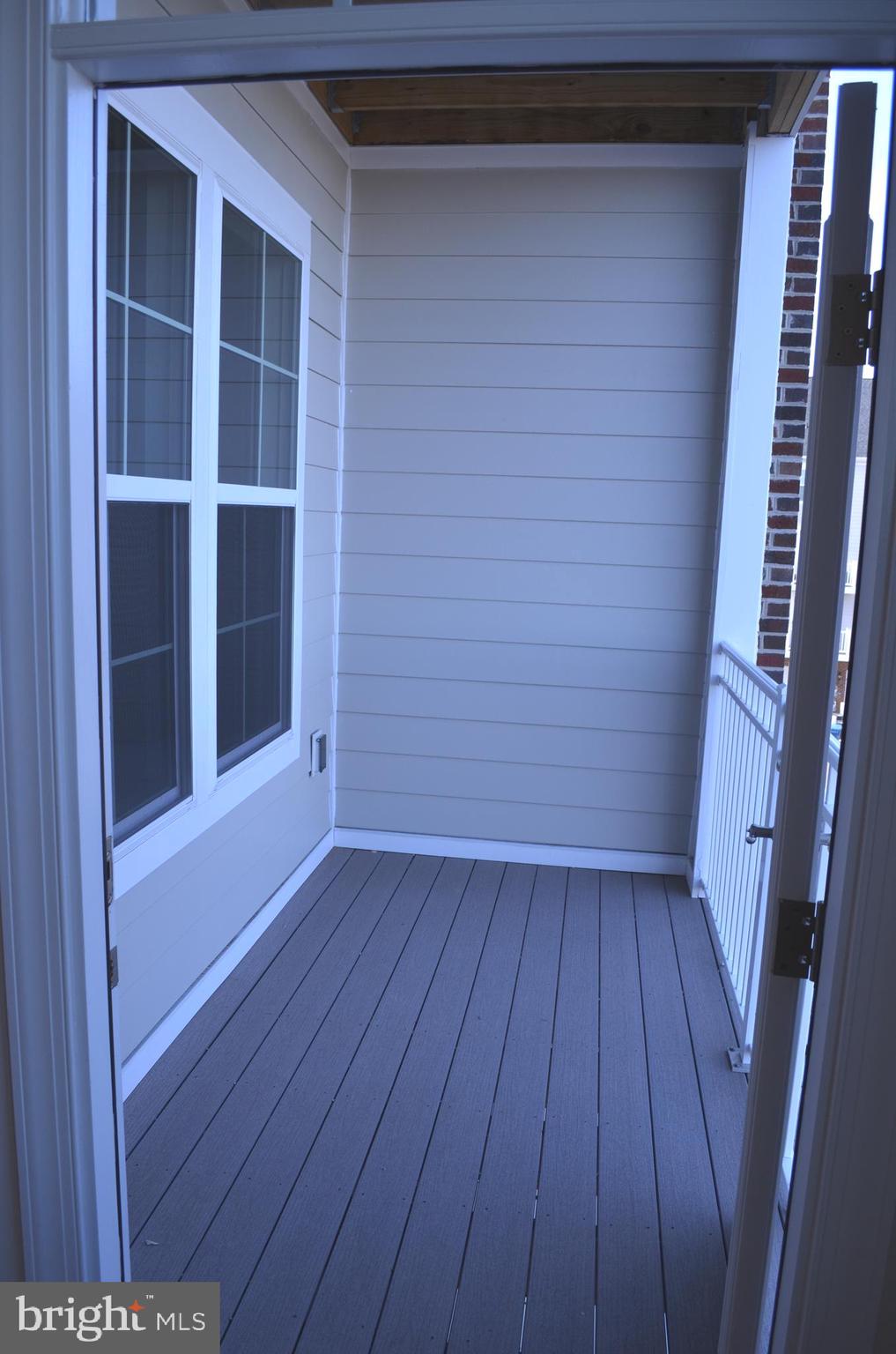 13724 Neil Armstrong Avenue, Unit 307 Herndon, VA 20171 - Photo 7 of 20 Covered Deck off the Living Room