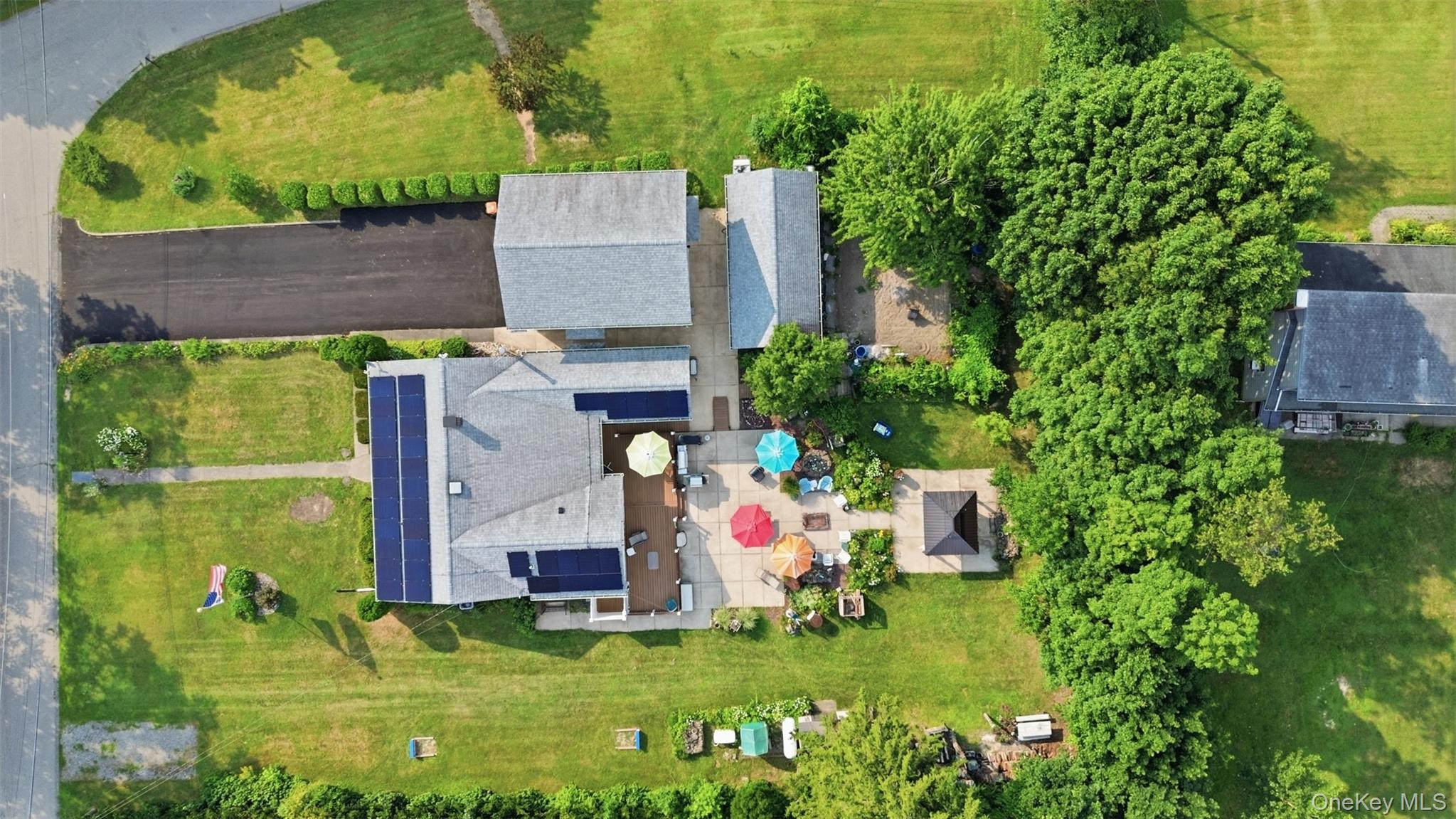 1 Hiko Place Fishkill, NY 12524 - Photo 4 of 41 Expansive property featuring a main residence with solar panels, a detached garage, and a large paved driveway
