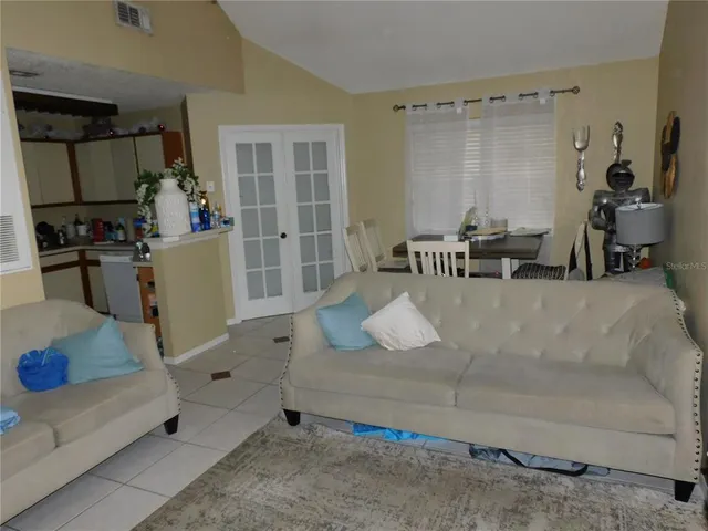 a living room with furniture and a table