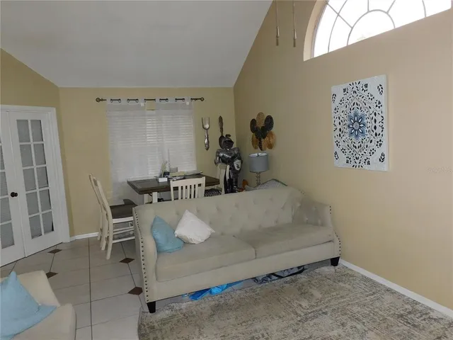 a room with a bed and a table in it