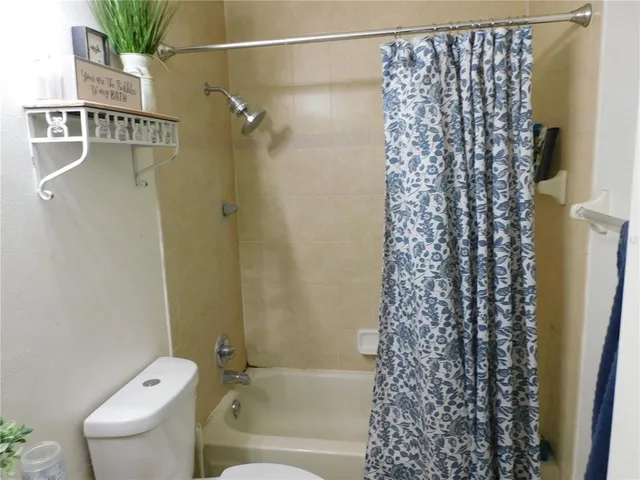 a bathroom with a sink toilet and mirror