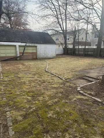 a view of yard with large tree