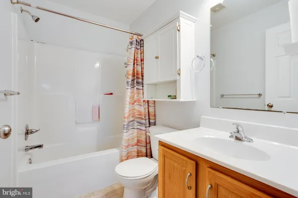 a bathroom with a sink toilet tub and shower