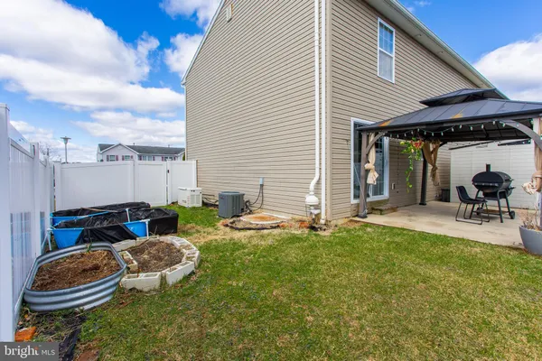 a backyard of a house with seating space