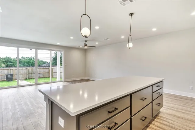 a kitchen with a sink and cabinets