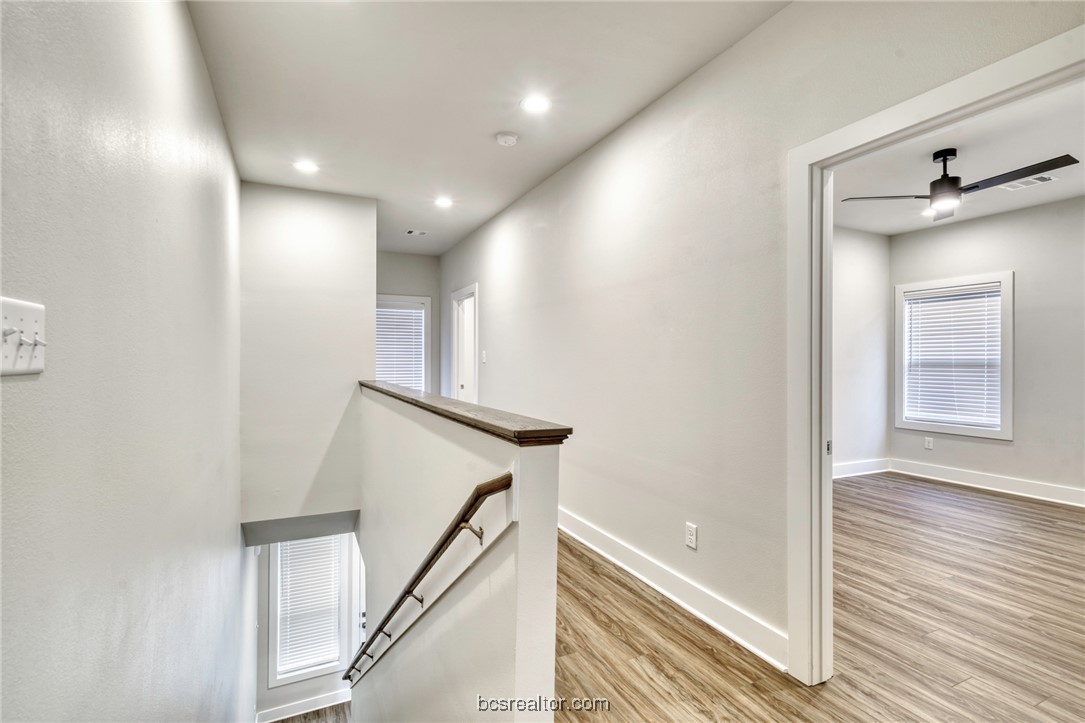 301 Cooner Street, Unit B College Station, TX 77840 - Photo 19 of 36 a view of a hallway with a chandelier