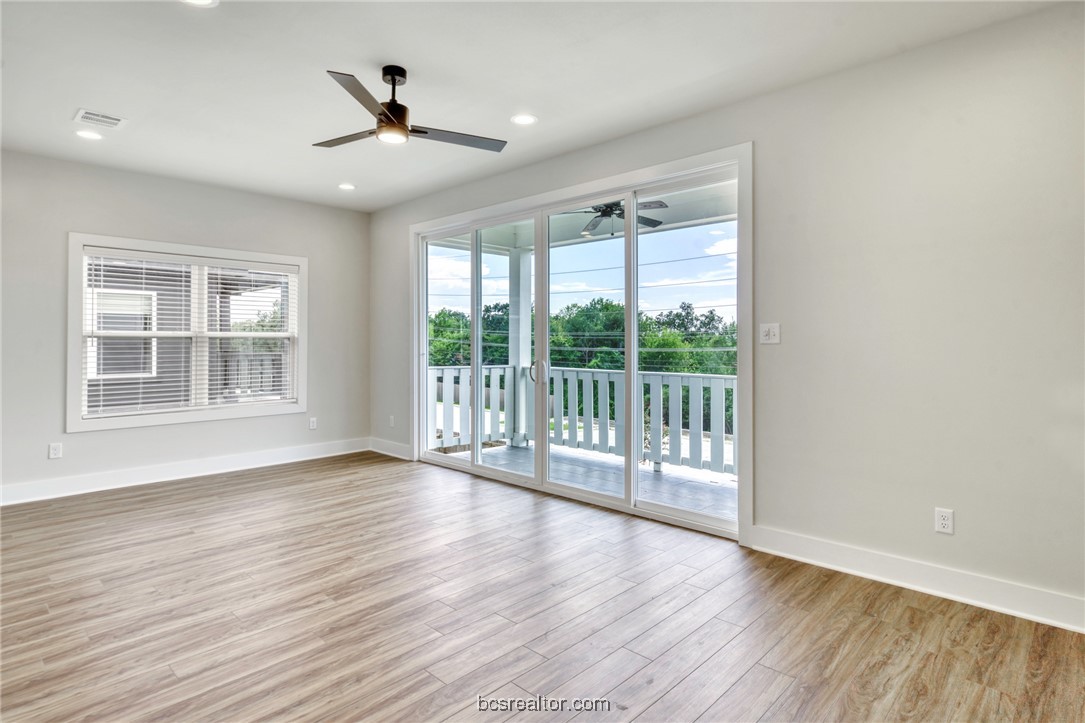 301 Cooner Street, Unit B College Station, TX 77840 - Photo 27 of 36 a view of an empty room with wooden floor and a window