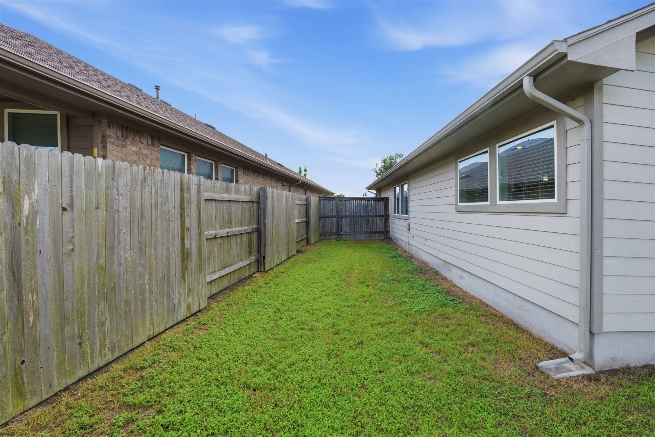276 Gunnison Way Kyle, TX 78640 - Photo 22 of 28 a backyard of a house with lots of green space