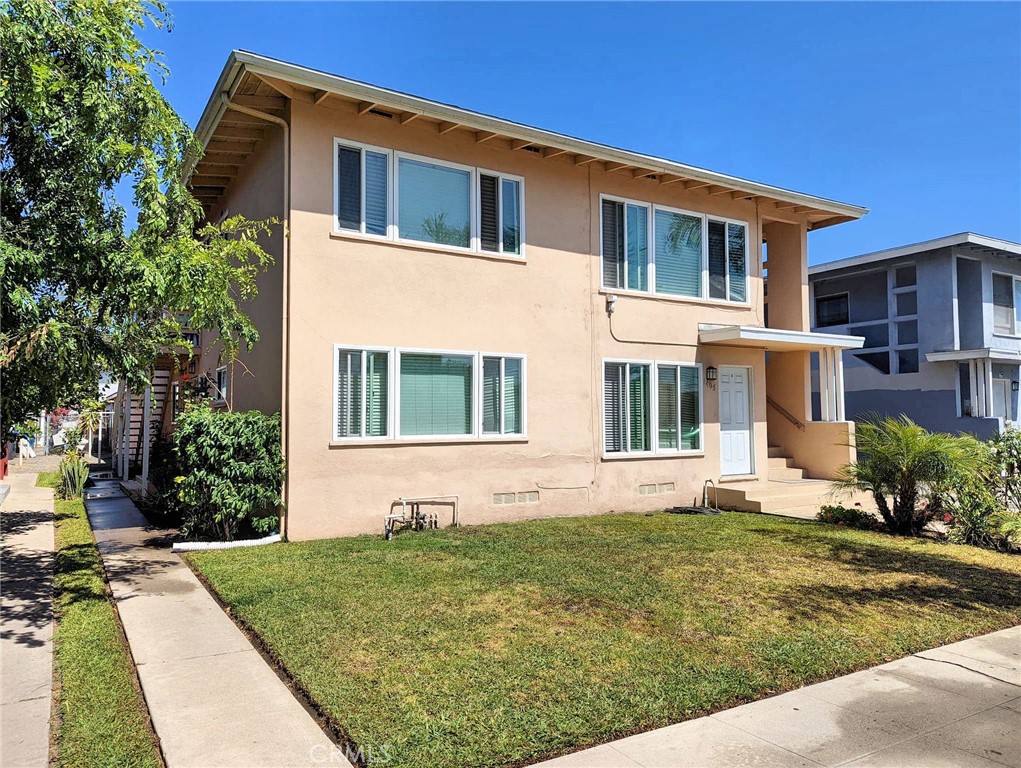 a front view of a house with garden