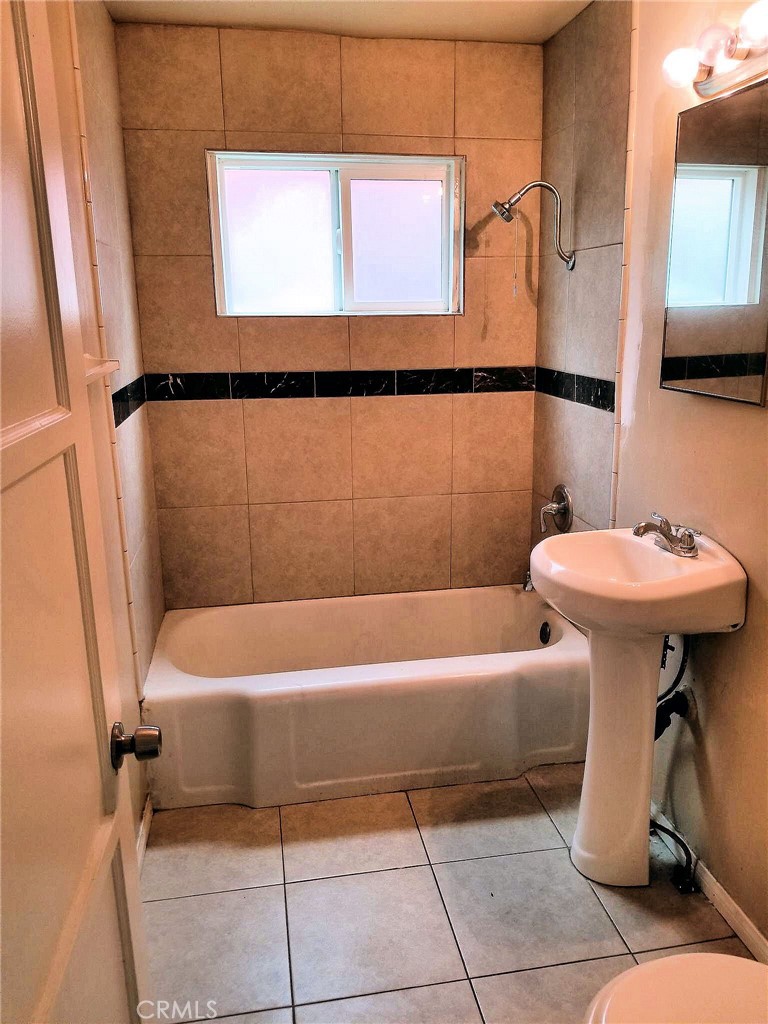 1405 South Broadway Santa Ana, CA 92707 - Photo 2 of 11 a bathroom with a sink a bath tub and a shower