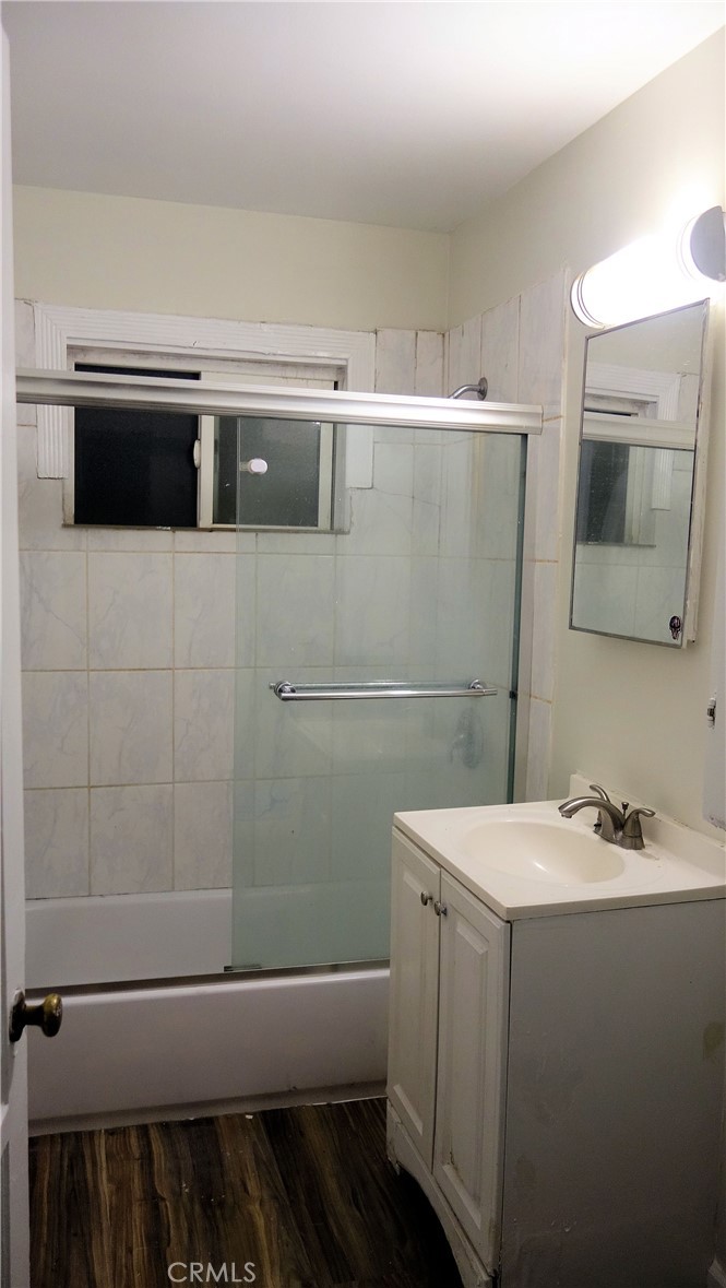 1405 South Broadway Santa Ana, CA 92707 - Photo 7 of 11 a bathroom with a sink and a mirror