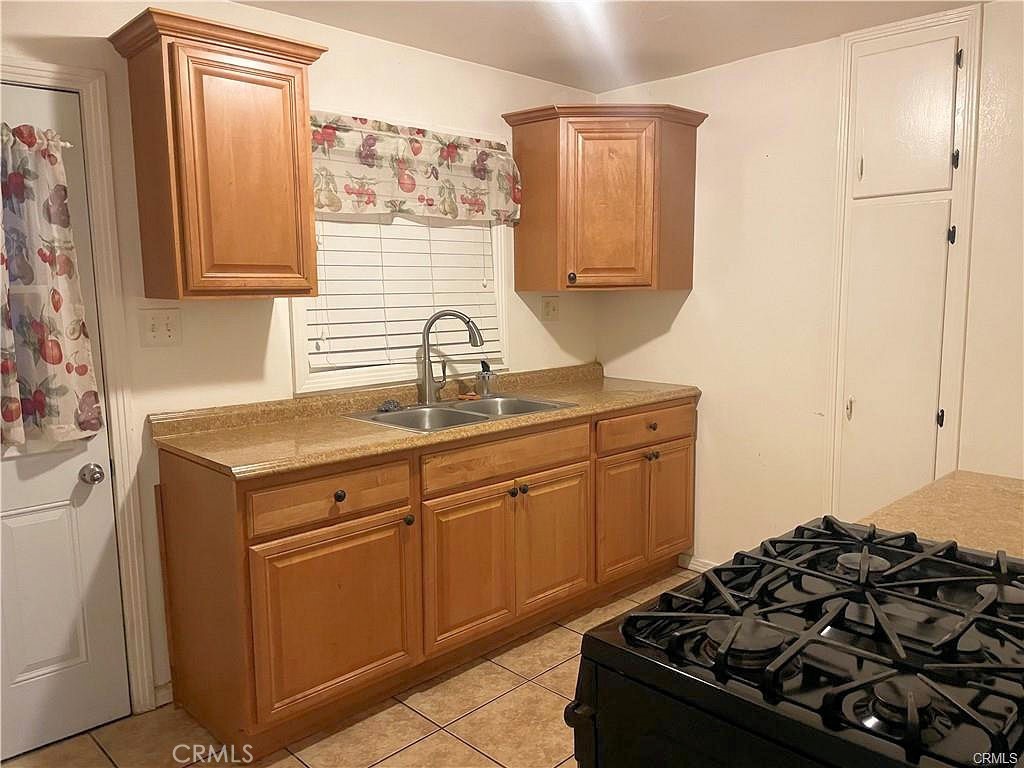 1405 South Broadway Santa Ana, CA 92707 - Photo 9 of 11 a kitchen with a stove and a sink