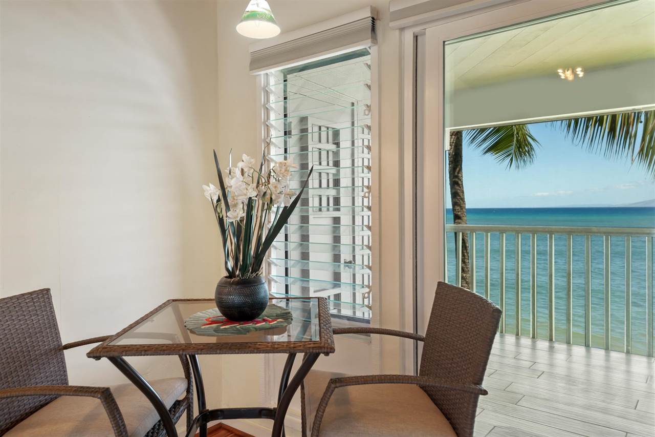Lower Honoapiilani Road, Unit 210 Lahaina, HI 96761 - Photo 11 of 29 a view of a dining room with furniture and a potted plant