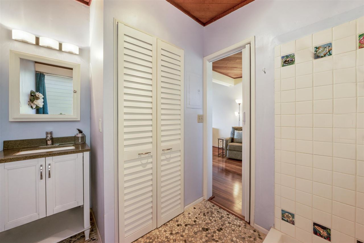 Lower Honoapiilani Road, Unit 210 Lahaina, HI 96761 - Photo 13 of 29 a bathroom with a shower and a sink