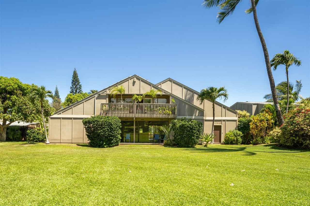 Lower Honoapiilani Road, Unit 210 Lahaina, HI 96761 - Photo 21 of 29 a front view of a house with a yard and potted plants