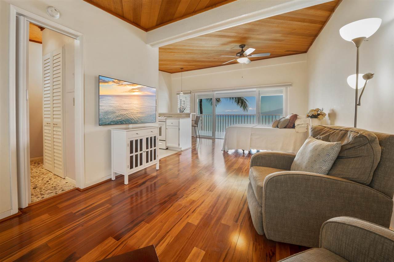 Lower Honoapiilani Road, Unit 210 Lahaina, HI 96761 - Photo 5 of 29 a living room with furniture and a flat screen tv