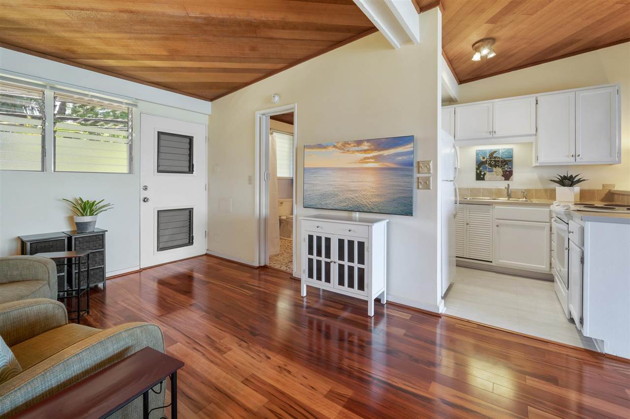 Lower Honoapiilani Road, Unit 210 Lahaina, HI 96761 - Photo 6 of 29 a kitchen with furniture wooden floor and a view of kitchen