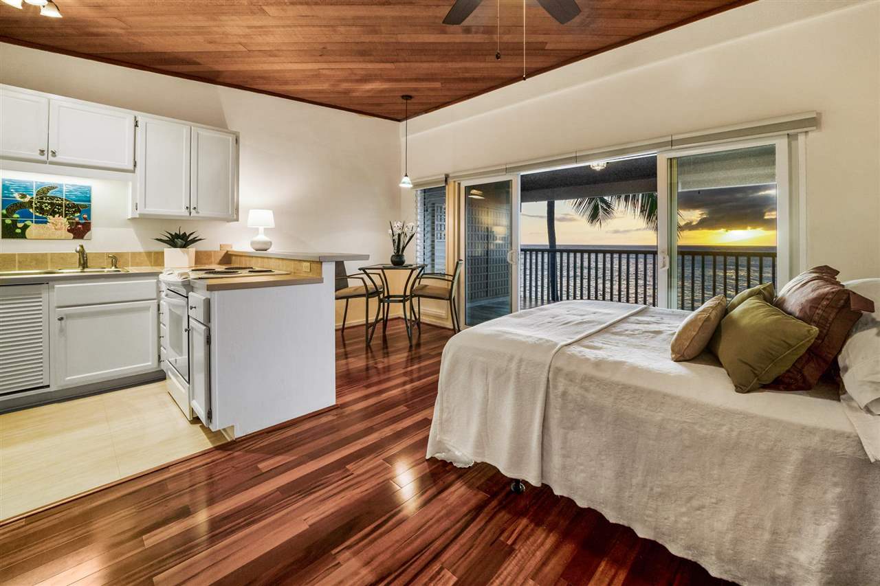 Lower Honoapiilani Road, Unit 210 Lahaina, HI 96761 - Photo 7 of 29 a bed room with a bed and a table