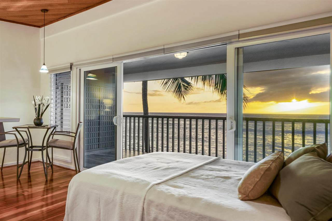 Lower Honoapiilani Road, Unit 210 Lahaina, HI 96761 - Photo 8 of 29 a bed sitting in a balcony next to a window