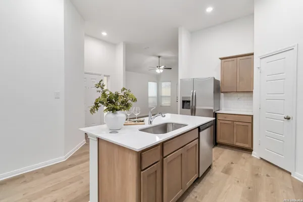 a kitchen with a sink and stove