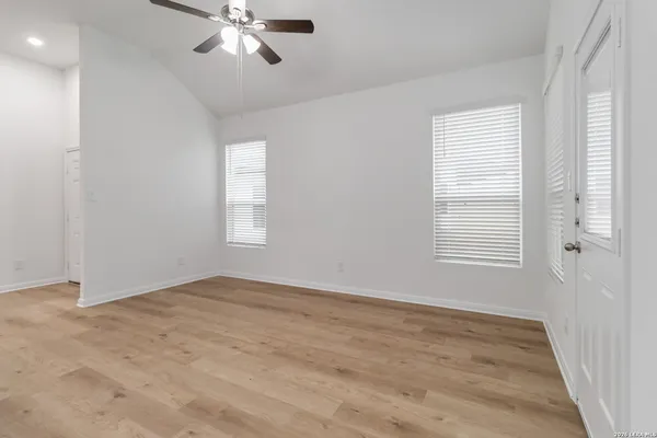 a view of an empty room with a window
