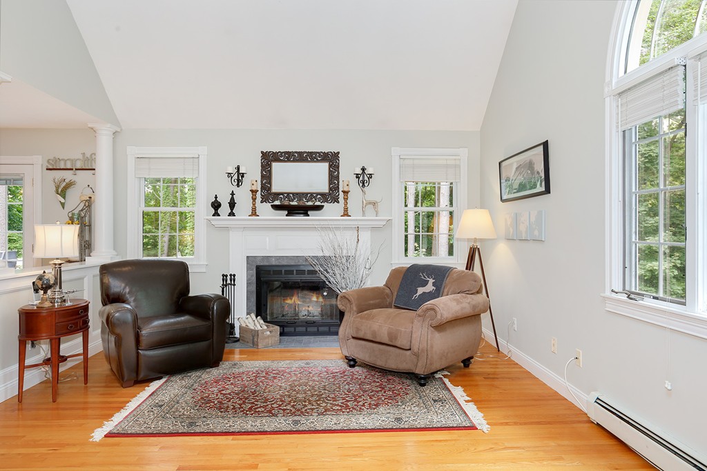 117 Perkins Row Topsfield, MA 01983 - Photo 12 of 28 a living room with furniture and a fireplace