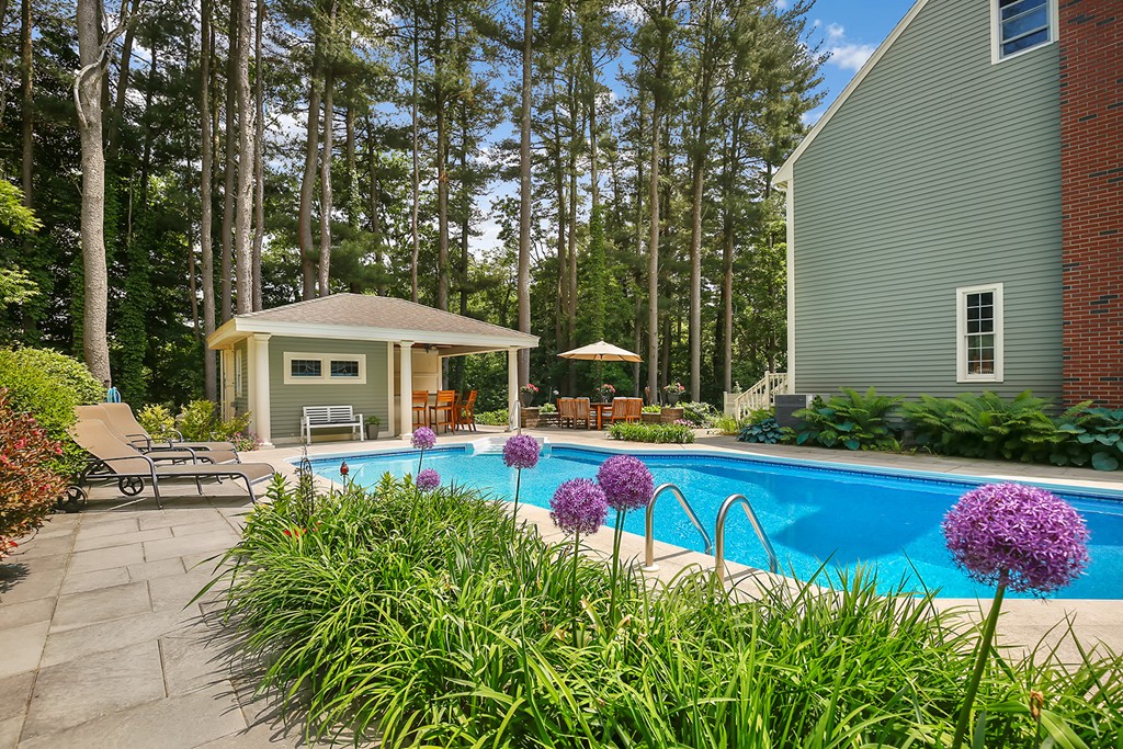 117 Perkins Row Topsfield, MA 01983 - Photo 23 of 28 a front view of a house with swimming pool having outdoor seating
