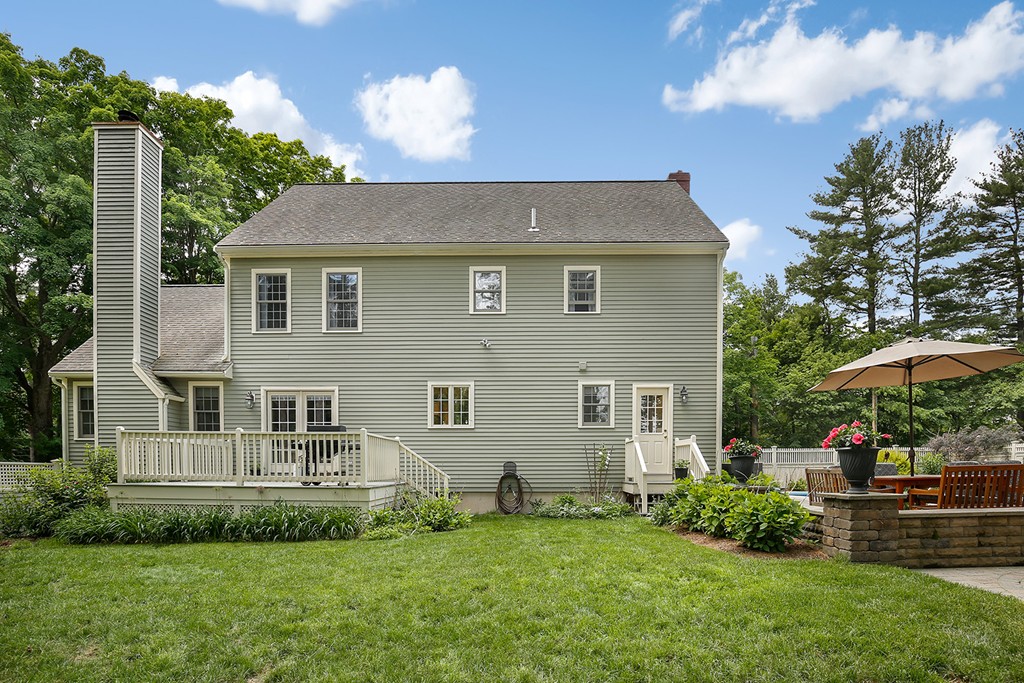 117 Perkins Row Topsfield, MA 01983 - Photo 27 of 28 a front view of a house with a garden