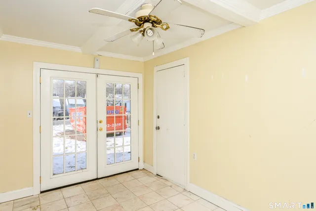 a view of a hallway with front door