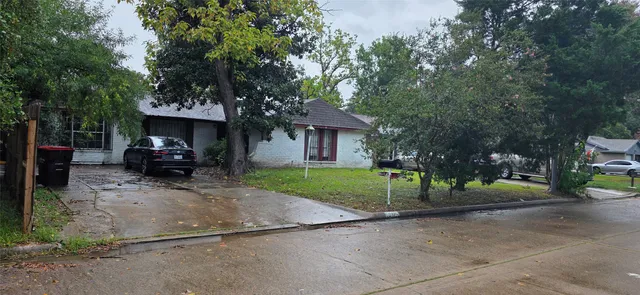 a view of a car parked in front of house