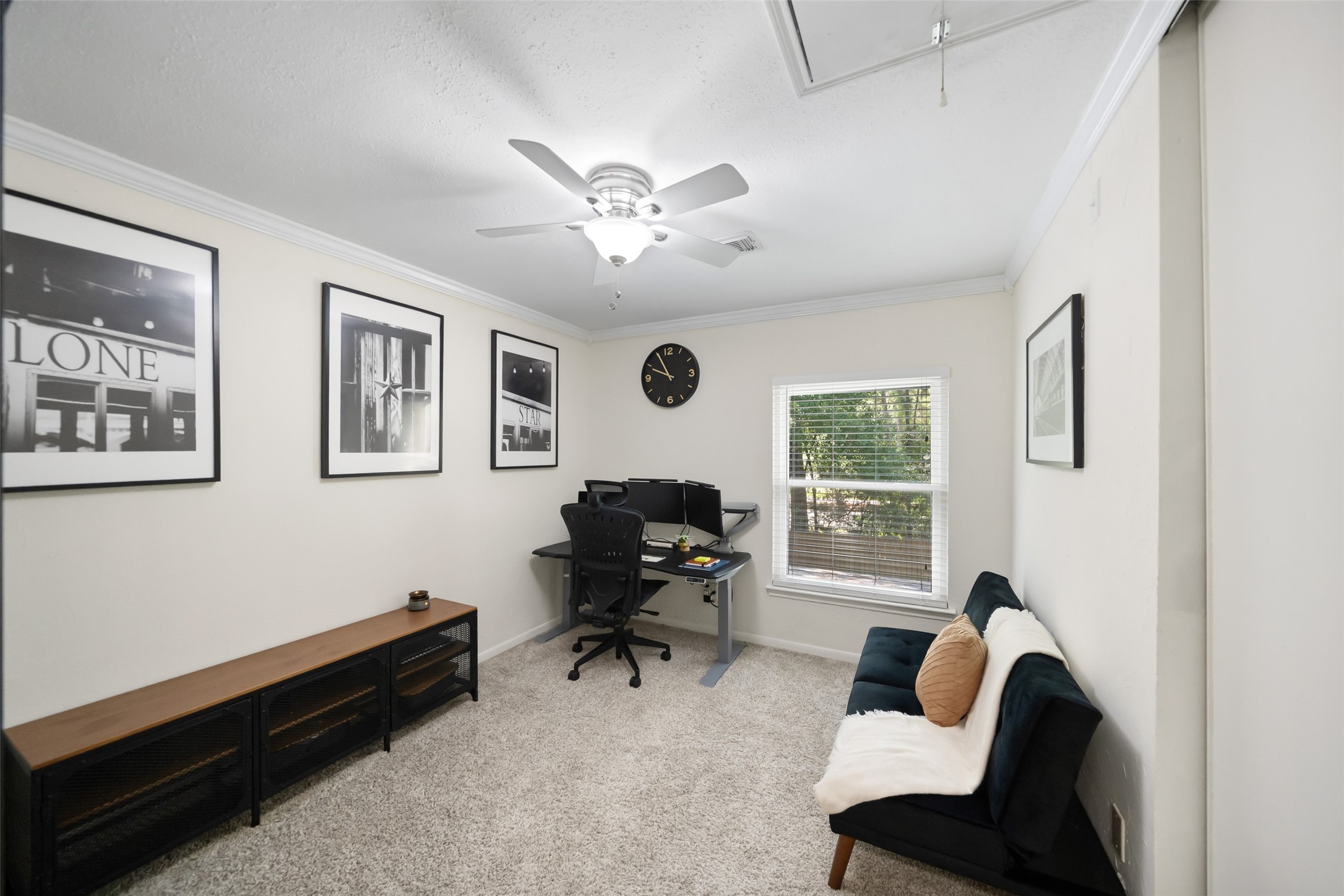 3 East Stony Bridge Circle Spring, TX 77381 - Photo 35 of 42 This versatile upper-level room features a built-in closet and a ceiling fan, offering a flexible layout that can easily serve as a third bedroom or a private home office.