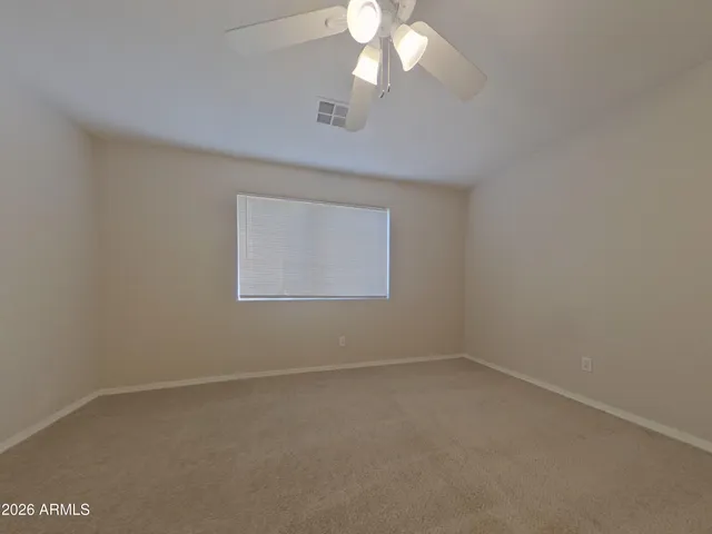 a kitchen with a refrigerator and a stove