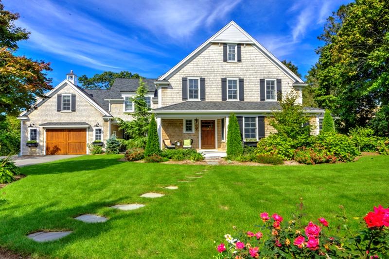 a front view of a house with a yard