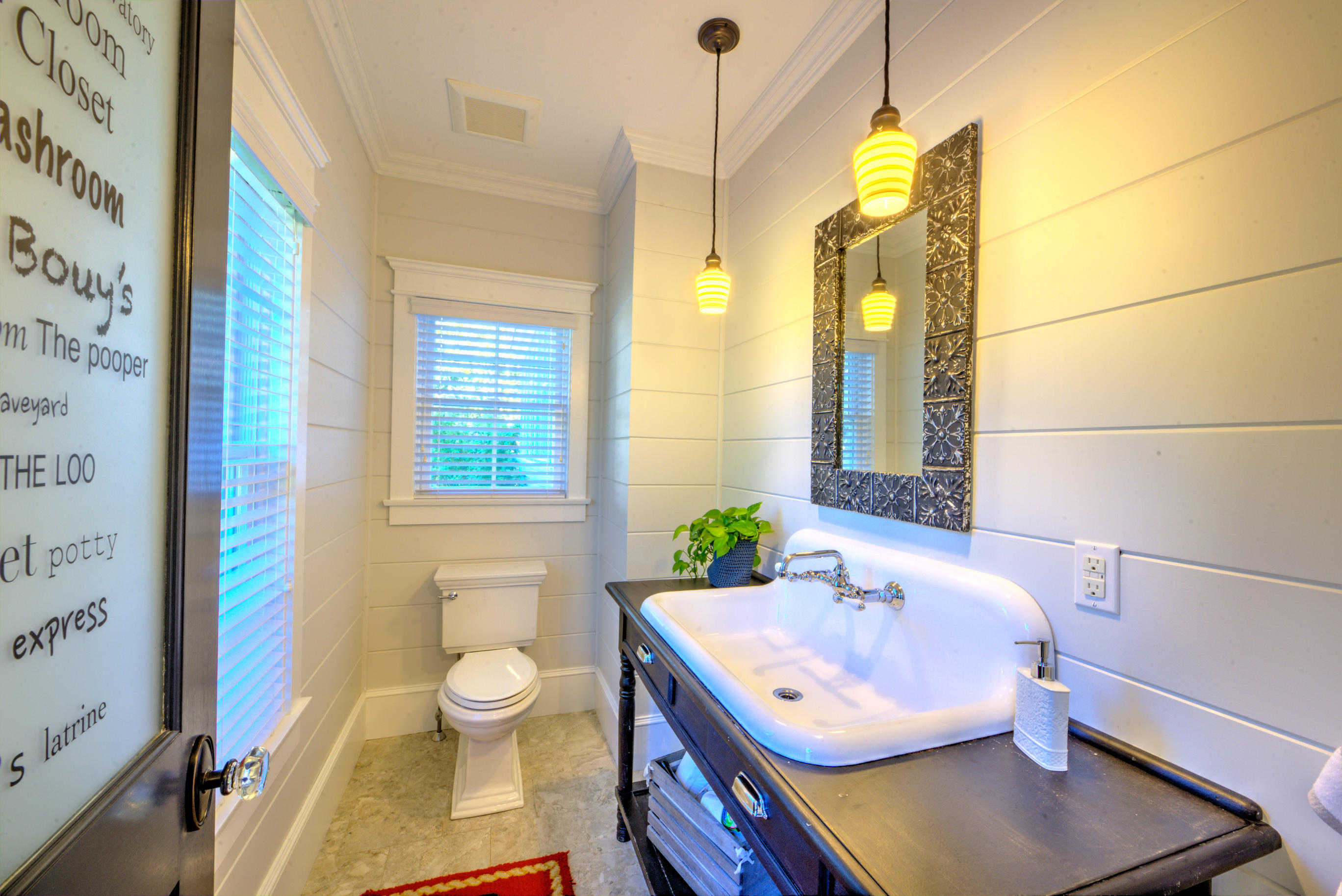 360 Main Street Osterville, MA 02655 - Photo 12 of 29 a bathroom with a granite countertop sink a toilet a mirror and shower