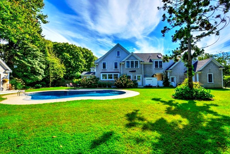 360 Main Street Osterville, MA 02655 - Photo 22 of 29 a view of a house with a yard patio and swimming pool