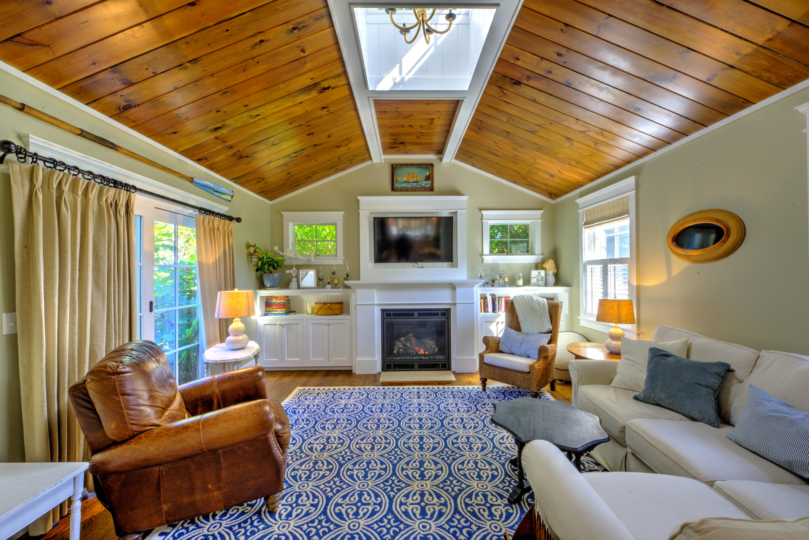 360 Main Street Osterville, MA 02655 - Photo 10 of 29 a living room with furniture a fireplace and a large window